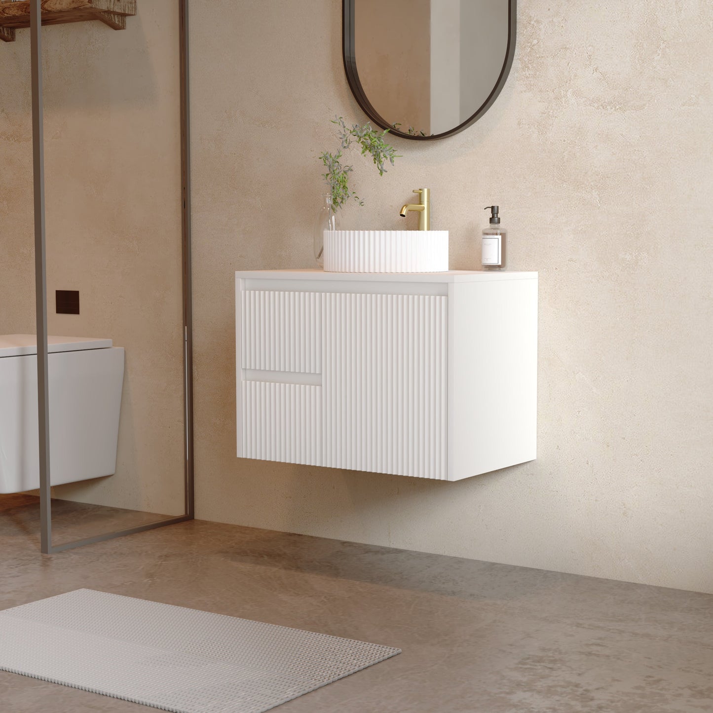 A modern floating bathroom vanity with a white ribbed cabinet, a white rectangular sink, and a gold faucet, shown in a minimalist beige-toned bathroom setting.