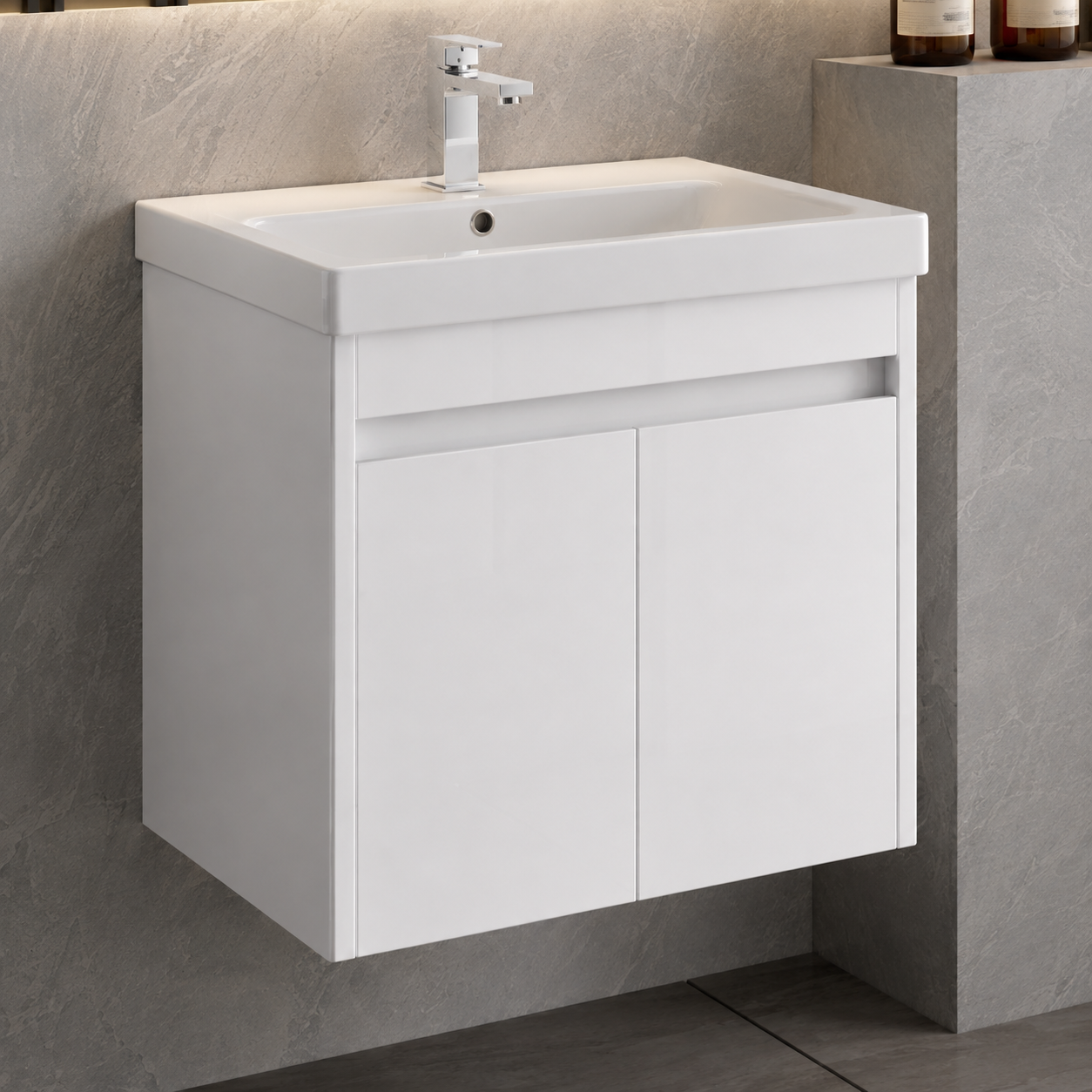A modern white wall-mounted bathroom vanity with an integrated rectangular sink and a chrome faucet, shown against a gray stone-look wall and floor.