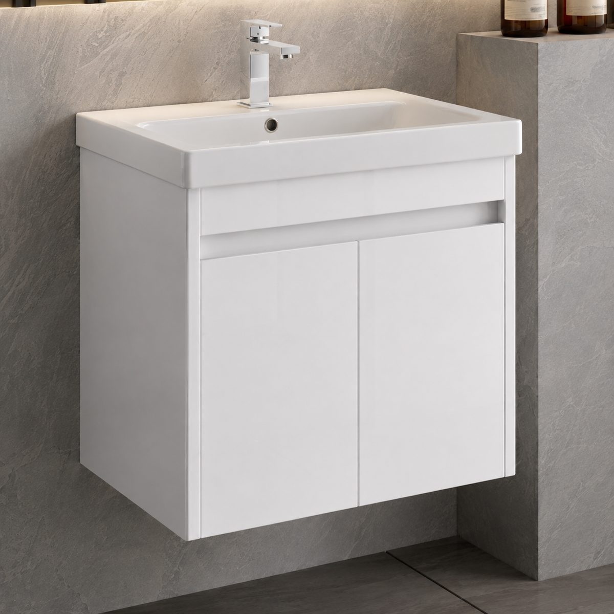 A modern white wall-mounted bathroom vanity with an integrated rectangular sink and a chrome faucet, shown against a gray stone-look wall and floor.
